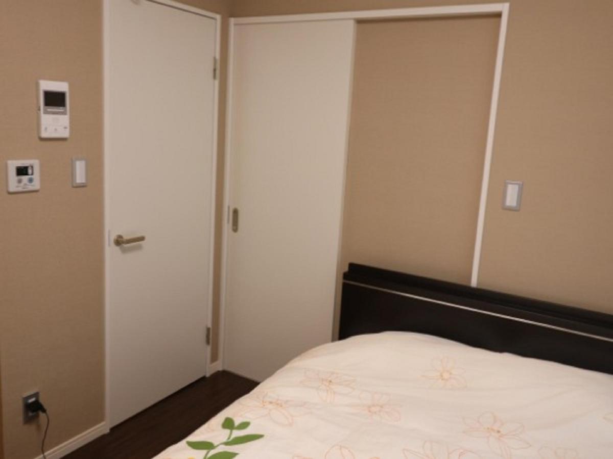 Mr. Kinjo In Makishi Lejlighedshotel Naha Værelse billede