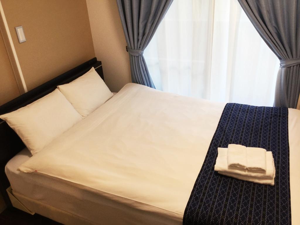 Mr. Kinjo In Makishi Lejlighedshotel Naha Eksteriør billede